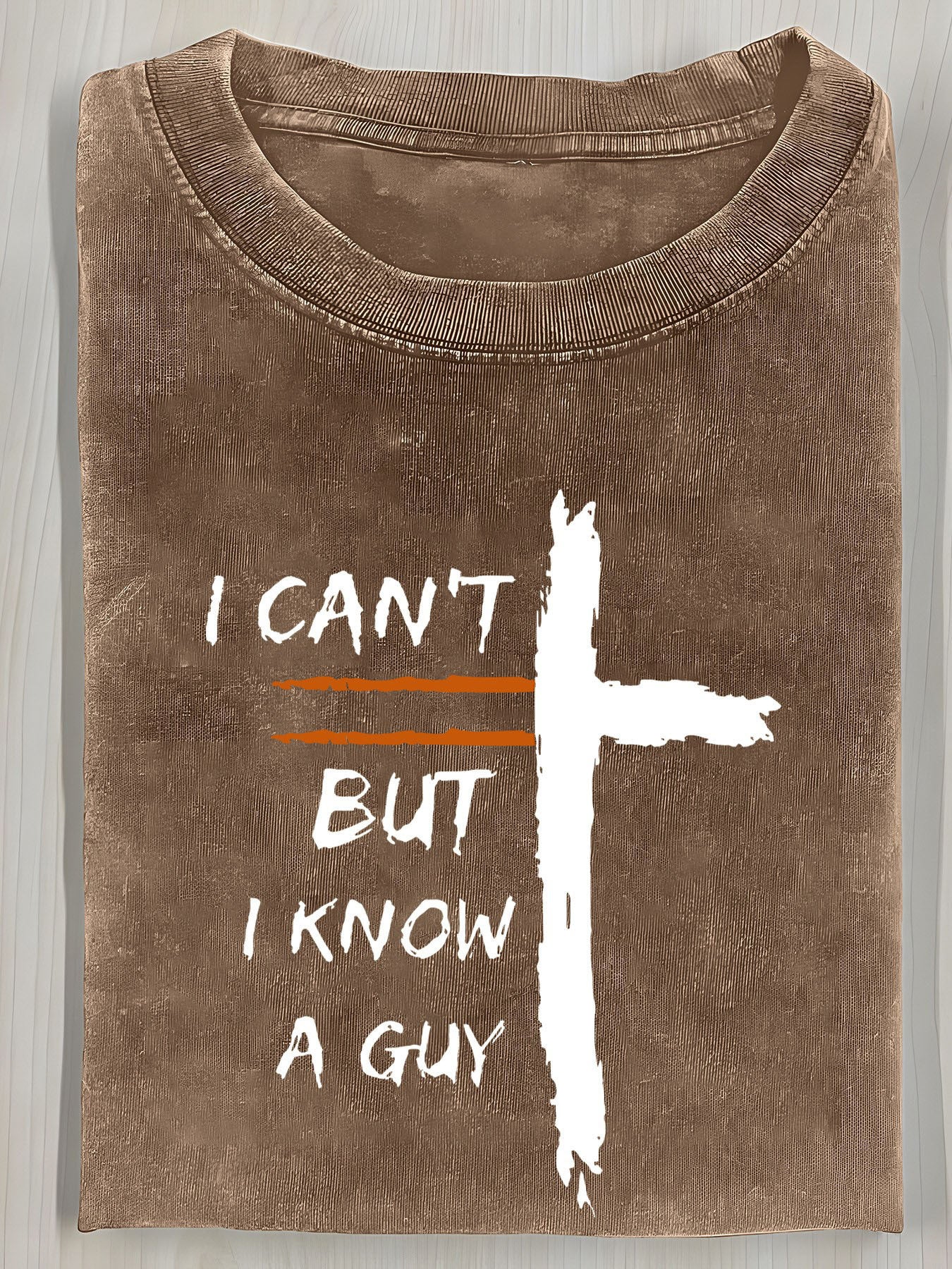 A Vintage Washed T-Shirt Featuring a Cross Print And The Bold Design "I Can'T, But I Know a Guy". It Has a Relaxed Fit, Round Neck, And Short Sleeves, Making It an Ideal Summer Gift for Men.