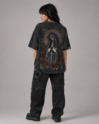 Distressed, vintage-style washed T-shirt featuring a Madonna, floral, and cross print; unisex short-sleeve design.