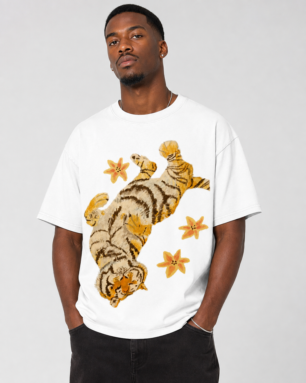 American-style acid-washed distressed, relaxed look with tiger and floral illustrations. Heavyweight vintage wash, oversized, loose fit, unisex T-shirt.