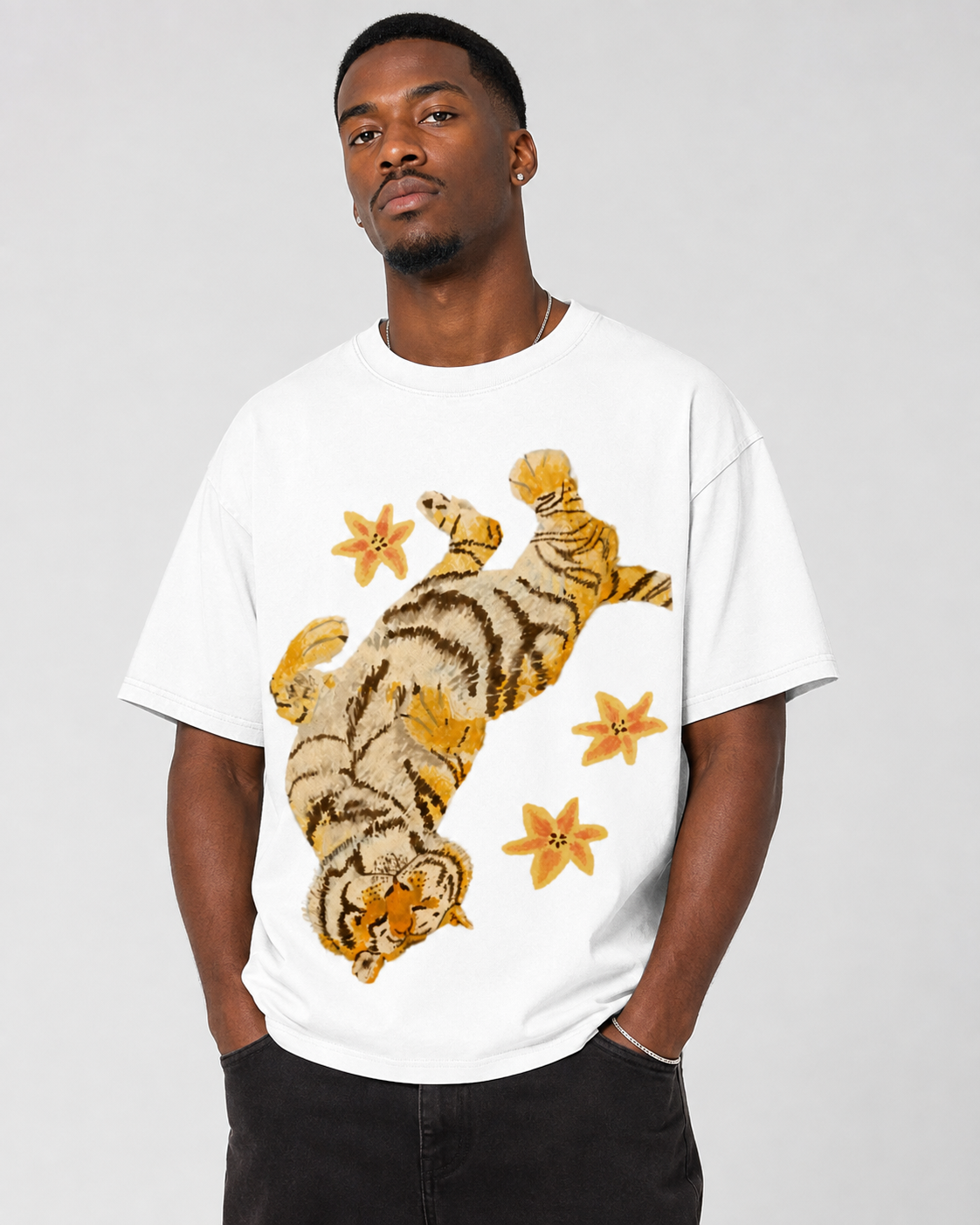 American-style acid-washed distressed, relaxed look with tiger and floral illustrations. Heavyweight vintage wash, oversized, loose fit, unisex T-shirt.