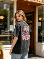 Women's vintage stone-washed, distressed short-sleeve T-shirt featuring a distinctive thorn graphic on the back and an oversized street-style fit.