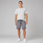 American vintage-style "dirty wash" shorts; distressed, faded, cotton-feel athletic shorts; versatile, casual unisex style.
