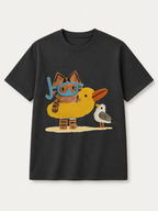 Summer Seaside-Themed Distressed Black Short-Sleeve T-Shirt – 100% Cotton, Oversized, Casual Tee Featuring a Cute Beach Kitten Cartoon