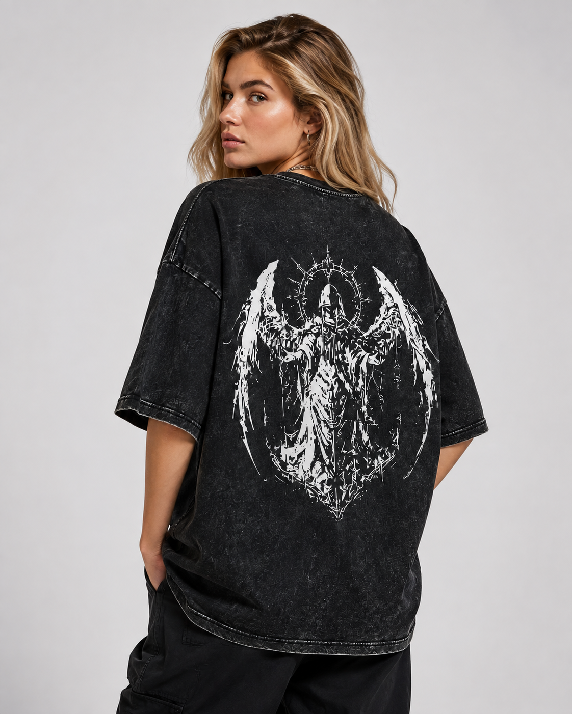 Vintage-wash black T-shirt featuring double-sided prints of a fallen archangel with a thorn halo; dark, heavy metal, and gothic style; loose-fitting short-sleeve unisex design.