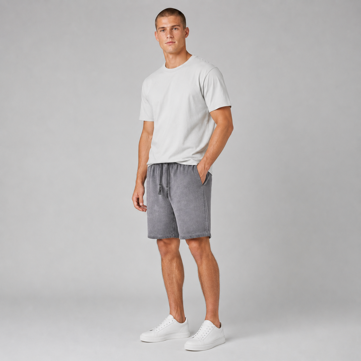 American vintage-style "dirty wash" shorts; distressed, faded, cotton-feel athletic shorts; versatile, casual unisex style.