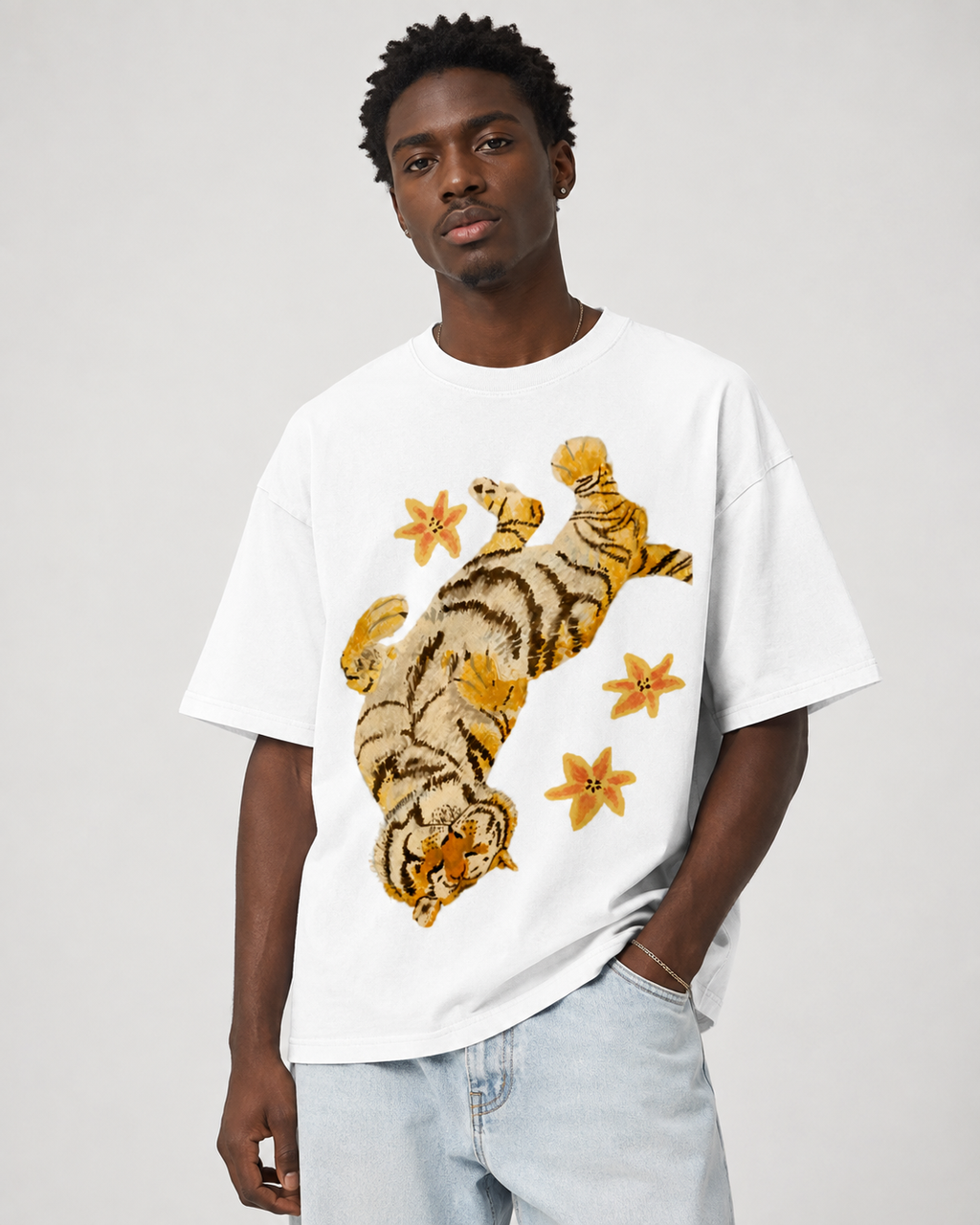 American-style acid-washed distressed, relaxed look with tiger and floral illustrations. Heavyweight vintage wash, oversized, loose fit, unisex T-shirt.
