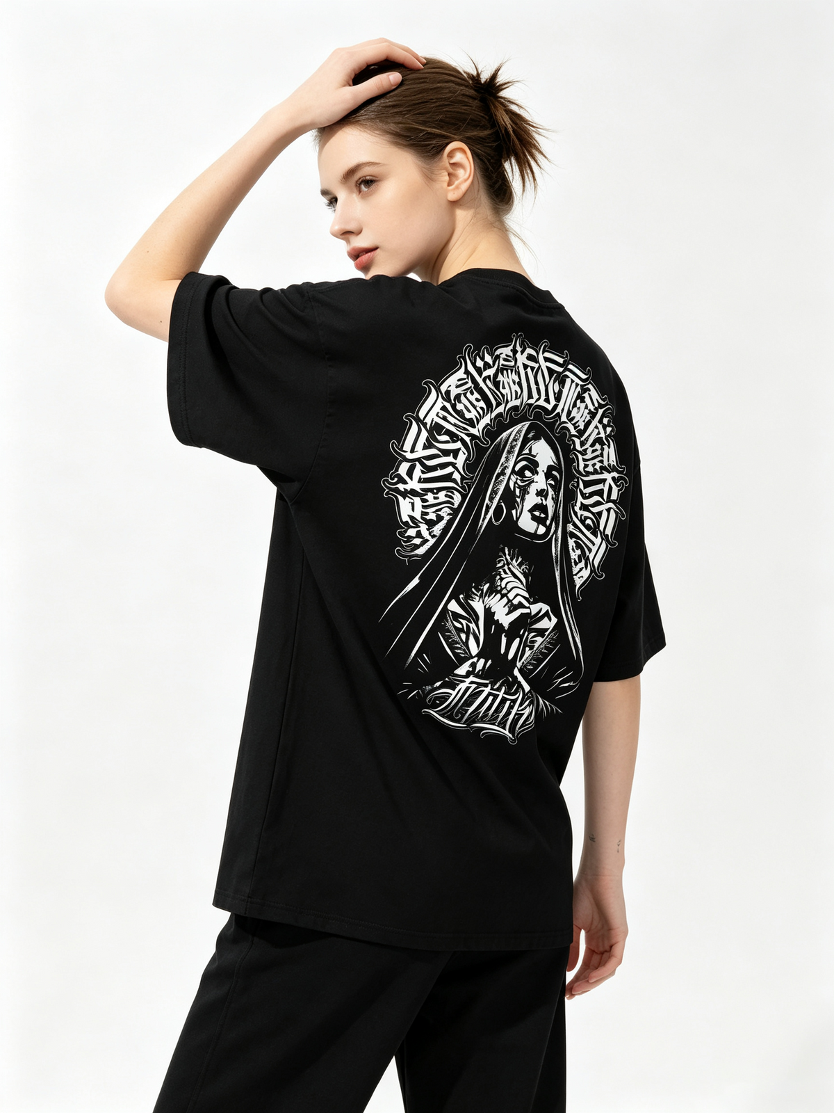 Oversized black pure cotton short-sleeve T-shirt featuring a large "Chicano-style" dark nun and Gothic lettering print on the back—an American street-style, hip-hop-inspired trendy tee for women.