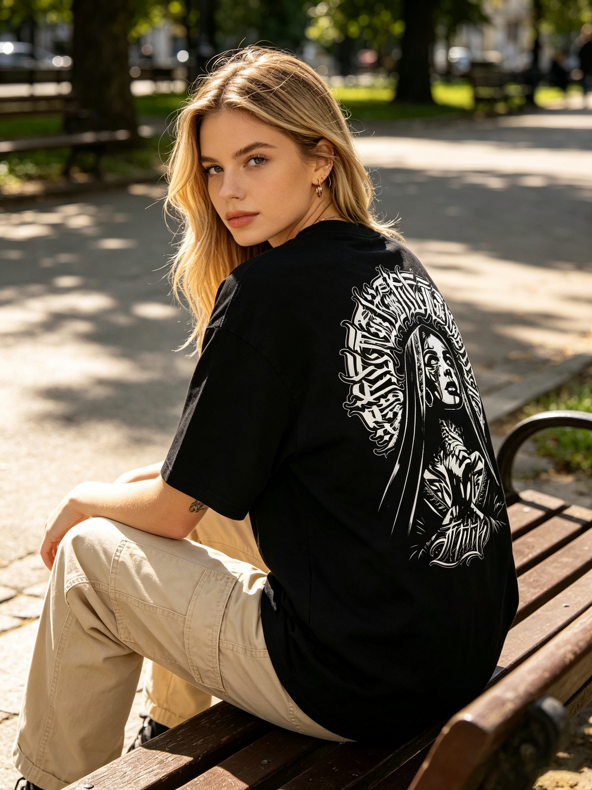 Oversized black pure cotton short-sleeve T-shirt featuring a large "Chicano-style" dark nun and Gothic lettering print on the back—an American street-style, hip-hop-inspired trendy tee for women.