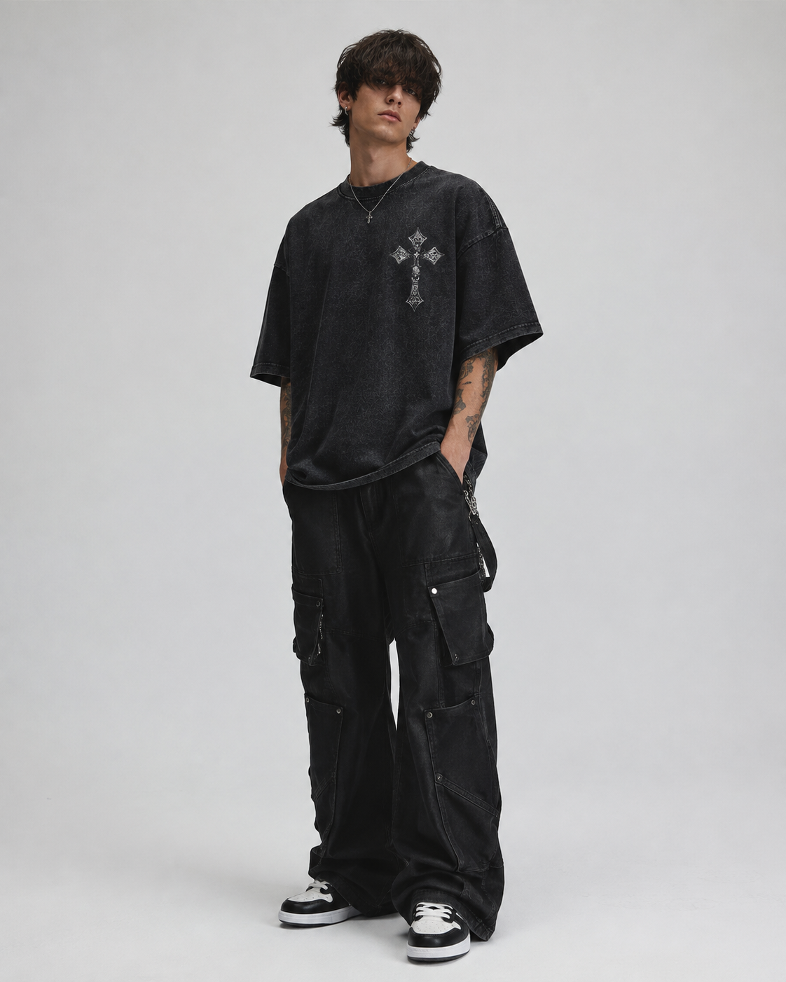 Distressed, vintage-style washed T-shirt featuring a Madonna, floral, and cross print; unisex short-sleeve design.