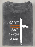 A Vintage Washed T-Shirt Featuring a Cross Print And The Bold Design "I Can'T, But I Know a Guy". It Has a Relaxed Fit, Round Neck, And Short Sleeves, Making It an Ideal Summer Gift for Men.