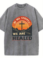 Local Delivery Vintage Loose, Washed Black Cross Sunset Print Pattern with Text 'Because of His Scourge We Are Healed', Suitable for Everyday Casual Scenes. Street Style, Weekend Outfit, Unique Shirt, Graphic, Breathable Material, Comfortable