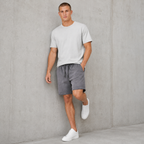 American vintage-style "dirty wash" shorts; distressed, faded, cotton-feel athletic shorts; versatile, casual unisex style.