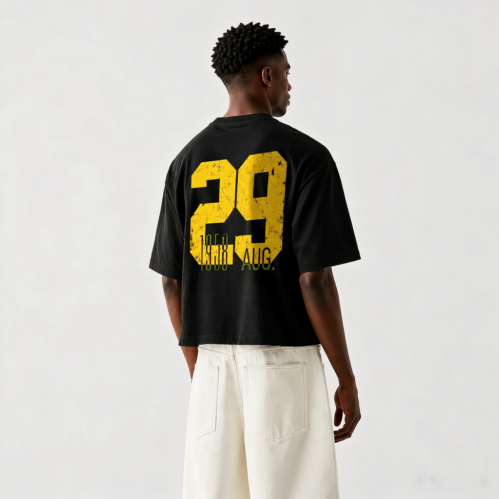 Vintage-style oversized drop-shoulder T-shirt featuring a large "29" back print with distressed, worn-effect typography; crafted from 100% cotton—a casual top with an American street-style vintage aesthetic.