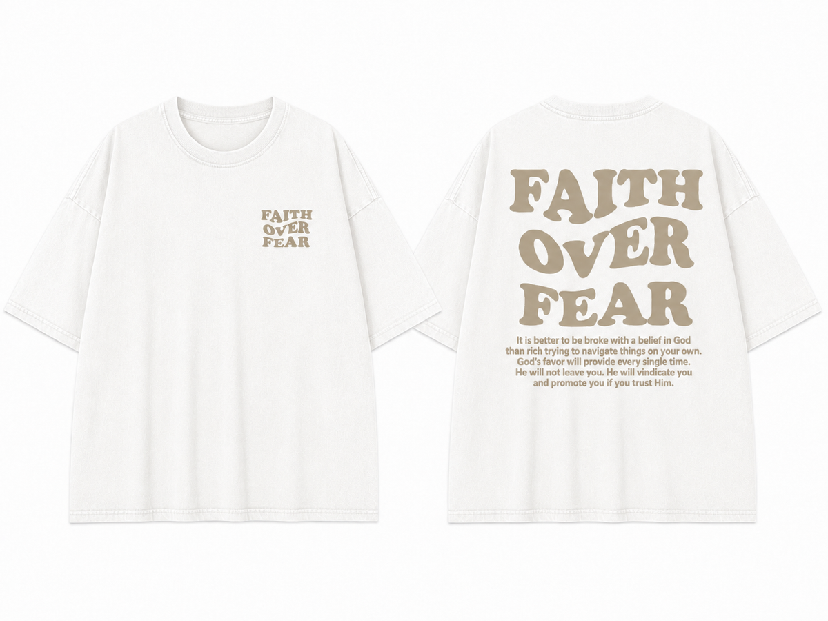 Vintage-style washed white T-shirt featuring the inspirational Christian slogan "Faith Over Fear" in a retro wavy font; a unisex, loose-fitting, distressed-look short-sleeve streetwear top.