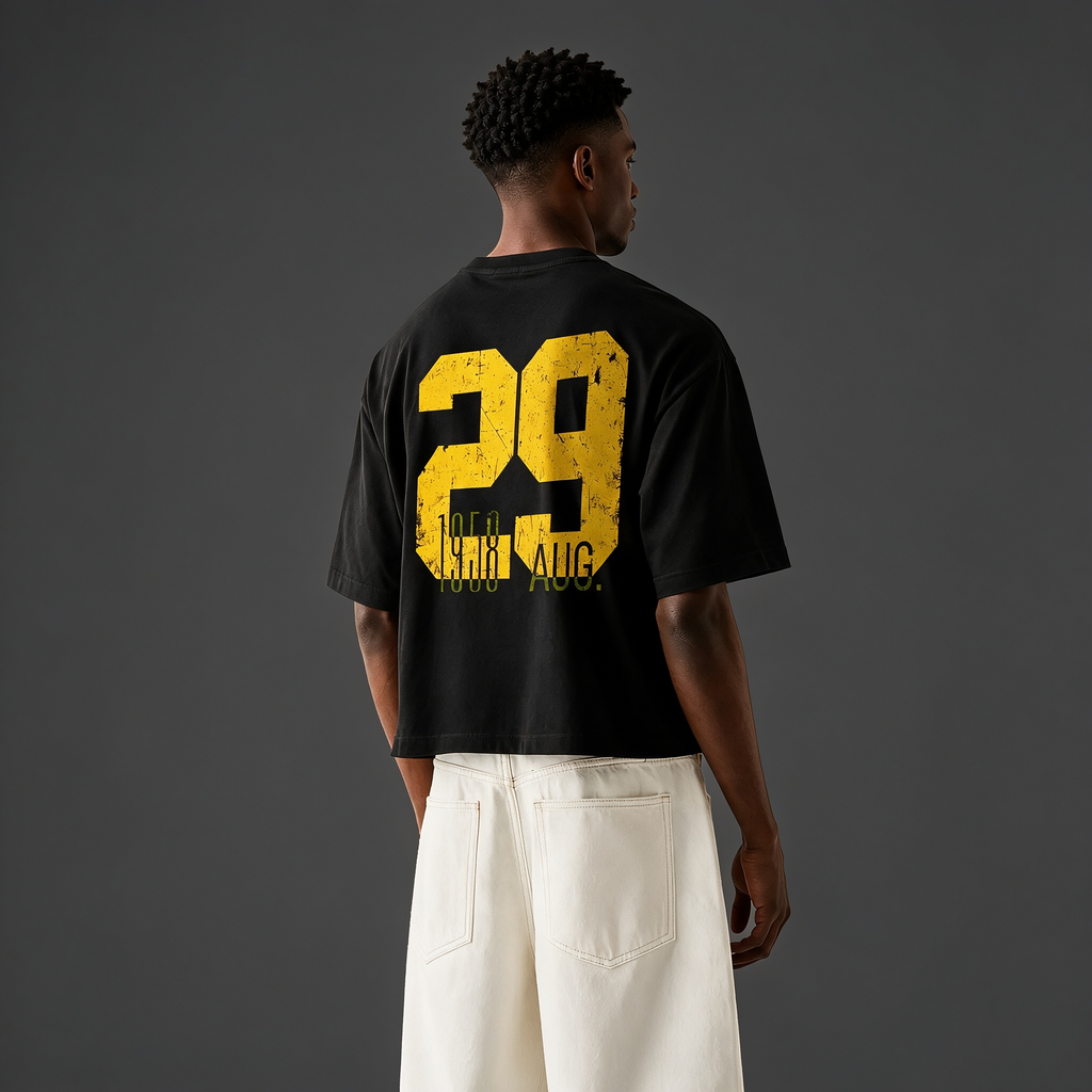Vintage-style oversized drop-shoulder T-shirt featuring a large "29" back print with distressed, worn-effect typography; crafted from 100% cotton—a casual top with an American street-style vintage aesthetic.