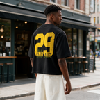 Vintage-style oversized drop-shoulder T-shirt featuring a large "29" back print with distressed, worn-effect typography; crafted from 100% cotton—a casual top with an American street-style vintage aesthetic.
