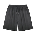 American vintage-style "dirty wash" shorts; distressed, faded, cotton-feel athletic shorts; versatile, casual unisex style.