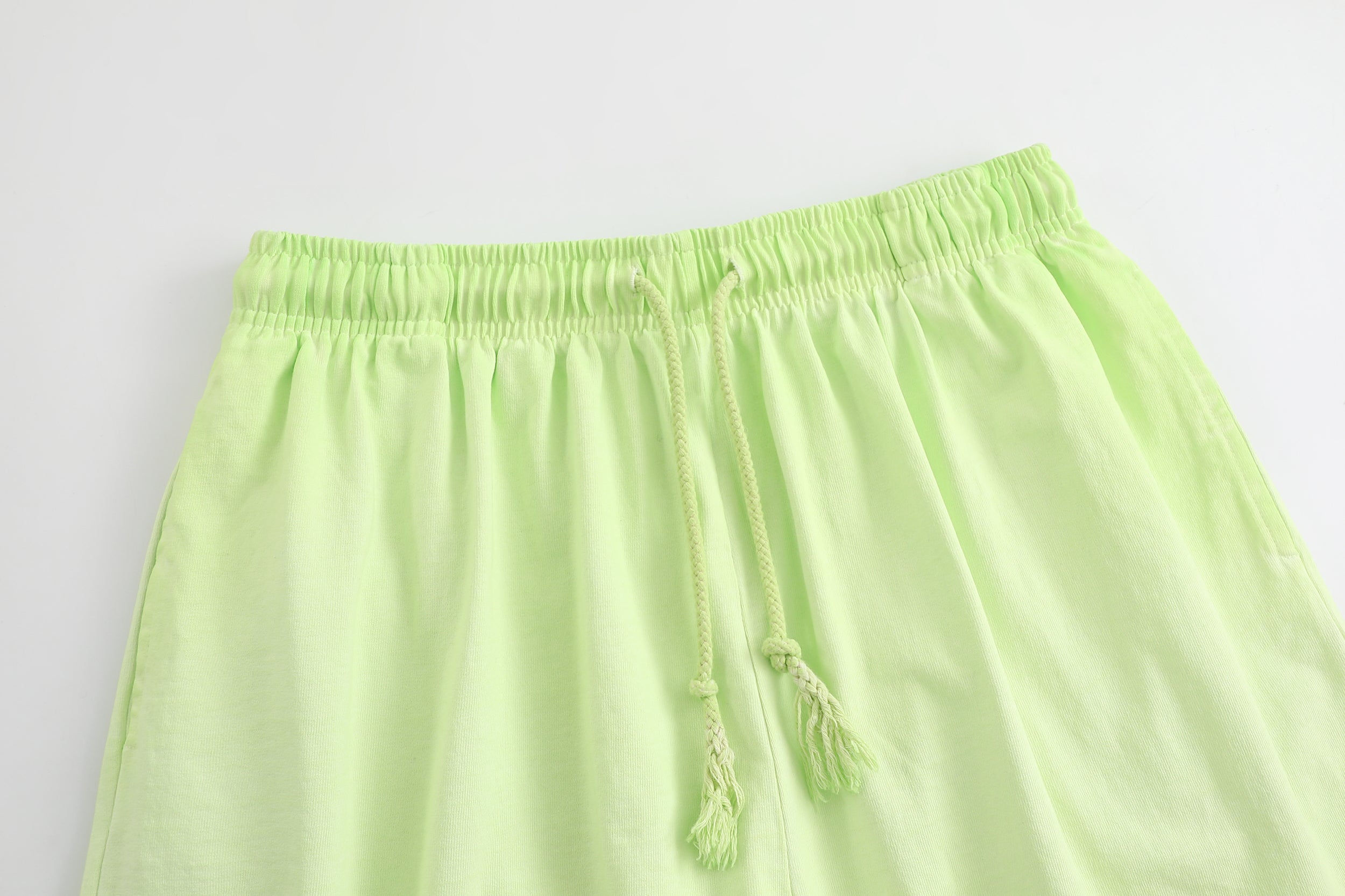 American vintage-style "dirty wash" shorts; distressed, faded, cotton-feel athletic shorts; versatile, casual unisex style.