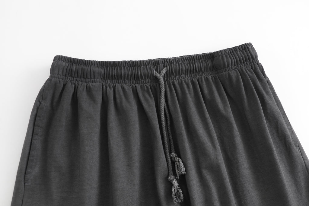 American vintage-style "dirty wash" shorts; distressed, faded, cotton-feel athletic shorts; versatile, casual unisex style.