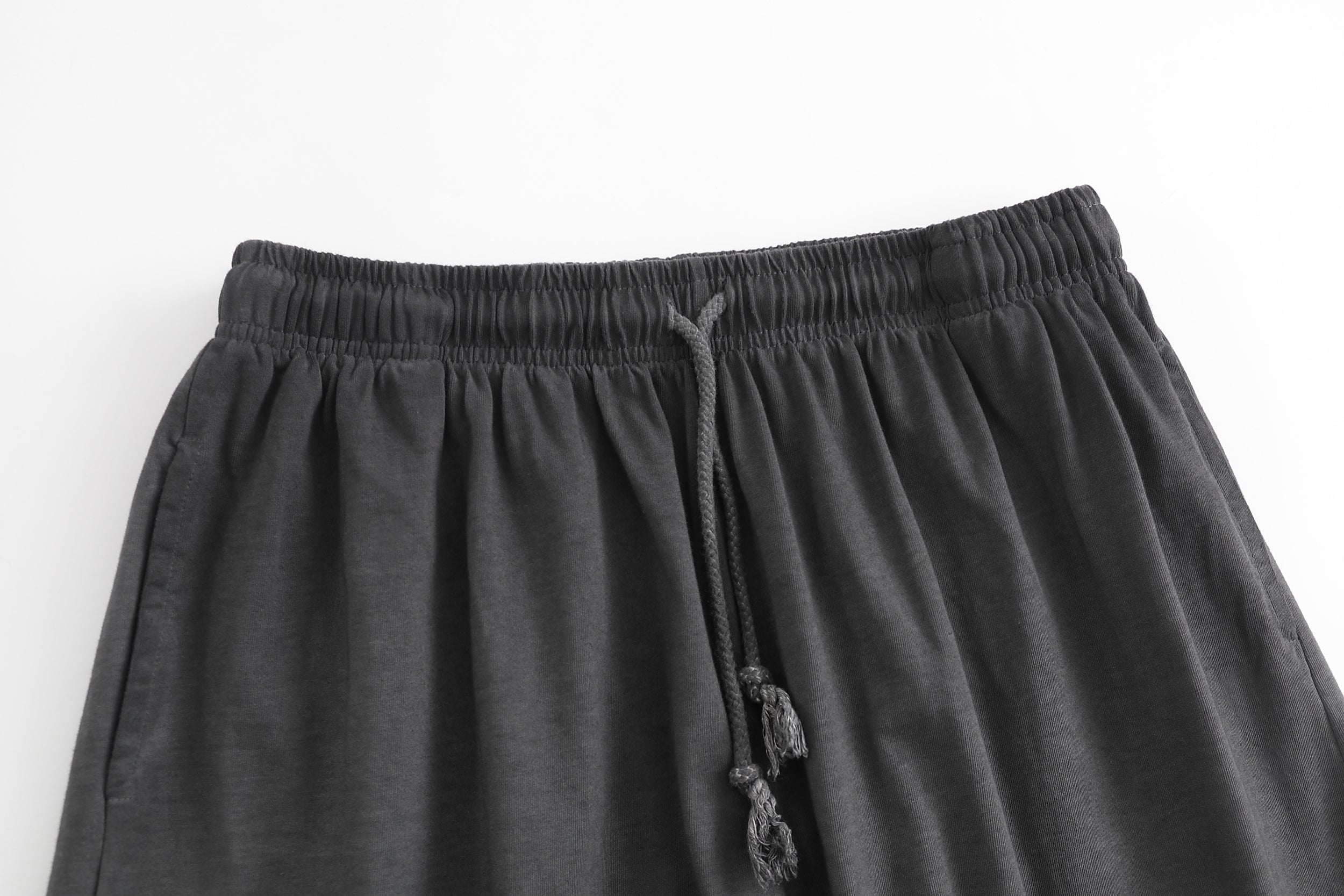 American vintage-style "dirty wash" shorts; distressed, faded, cotton-feel athletic shorts; versatile, casual unisex style.