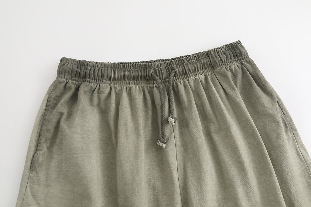 American vintage-style "dirty wash" shorts; distressed, faded, cotton-feel athletic shorts; versatile, casual unisex style.