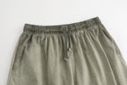 American vintage-style "dirty wash" shorts; distressed, faded, cotton-feel athletic shorts; versatile, casual unisex style.