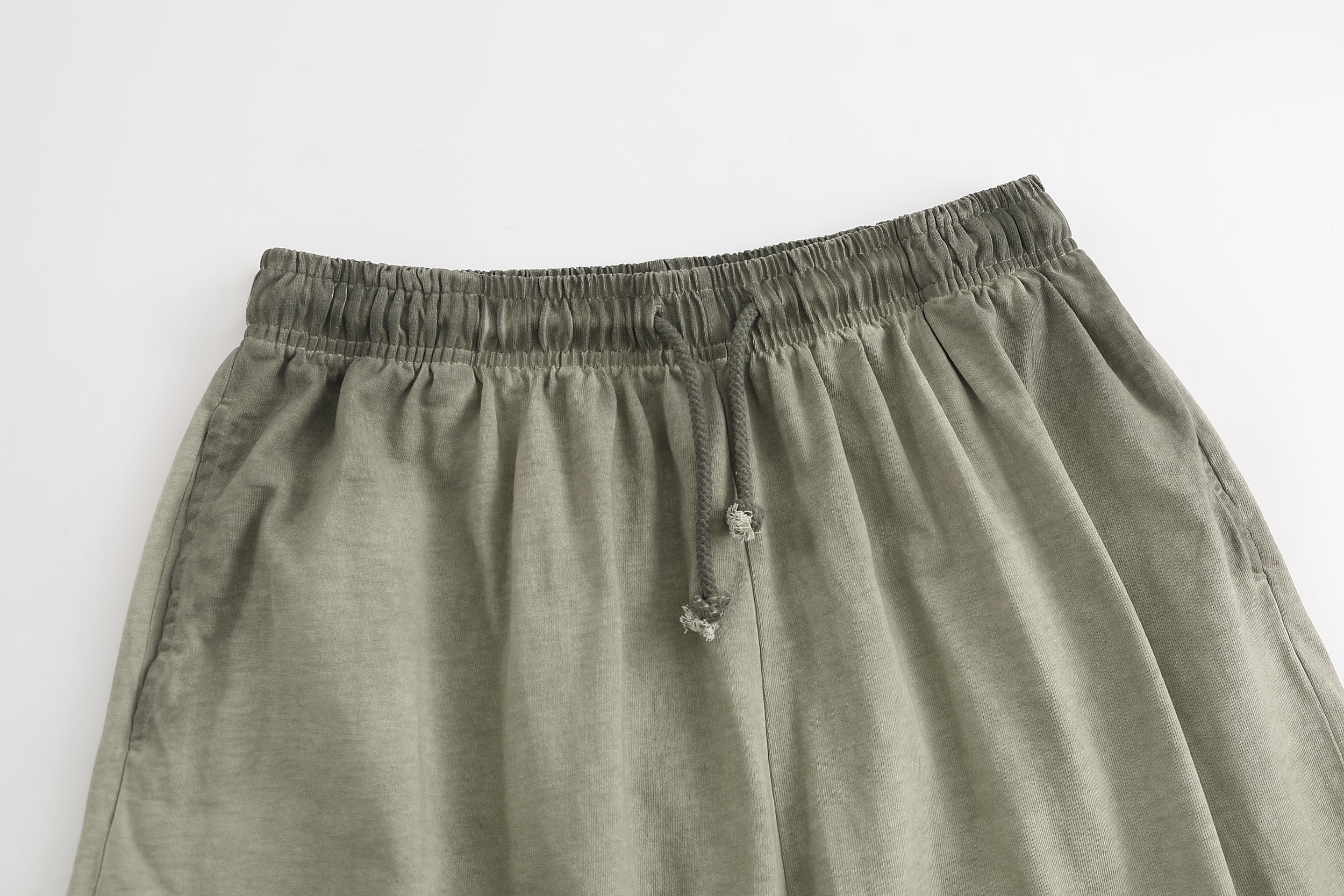 American vintage-style "dirty wash" shorts; distressed, faded, cotton-feel athletic shorts; versatile, casual unisex style.