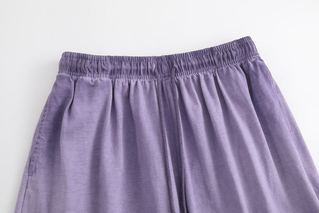 American vintage-style "dirty wash" shorts; distressed, faded, cotton-feel athletic shorts; versatile, casual unisex style.