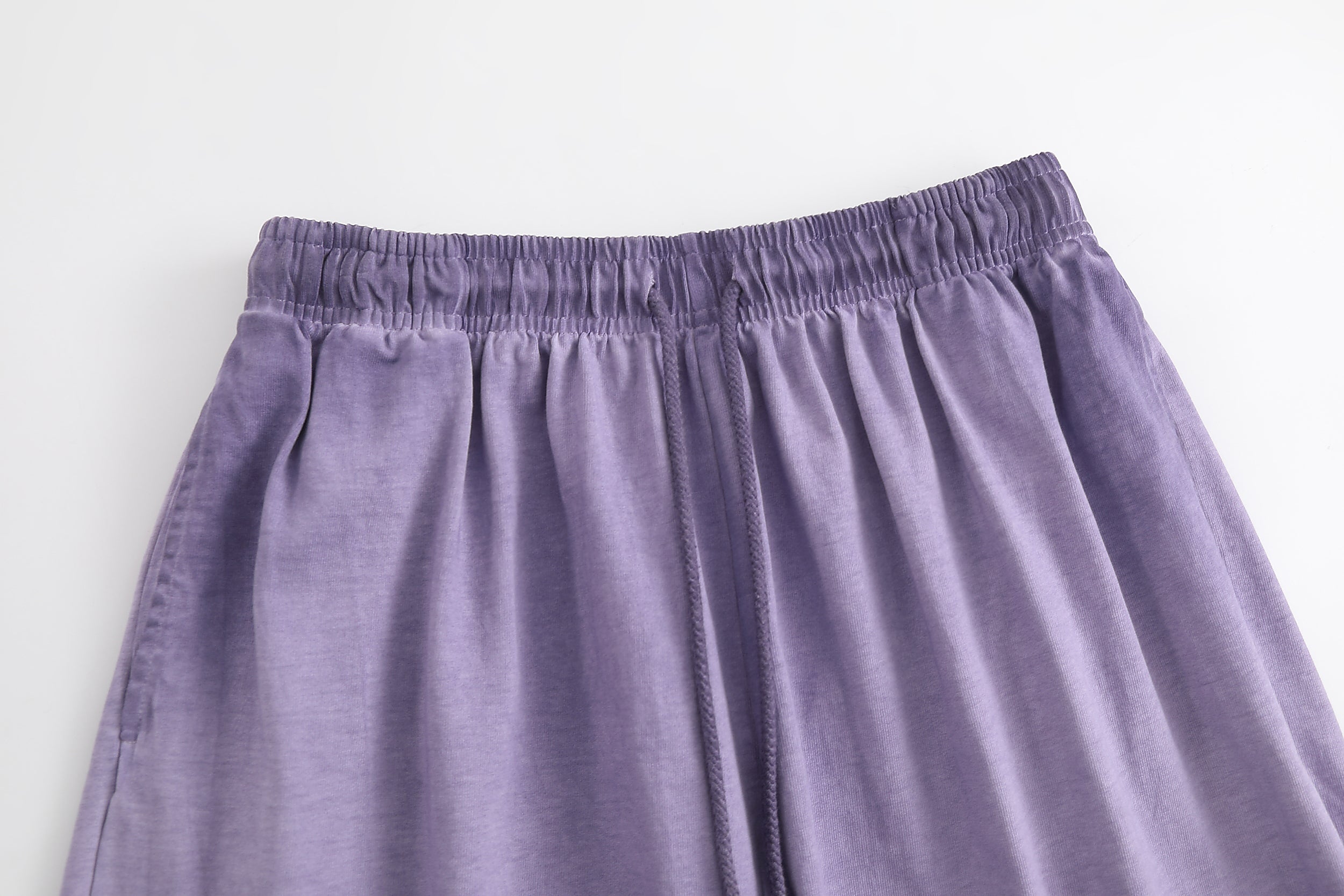 American vintage-style "dirty wash" shorts; distressed, faded, cotton-feel athletic shorts; versatile, casual unisex style.