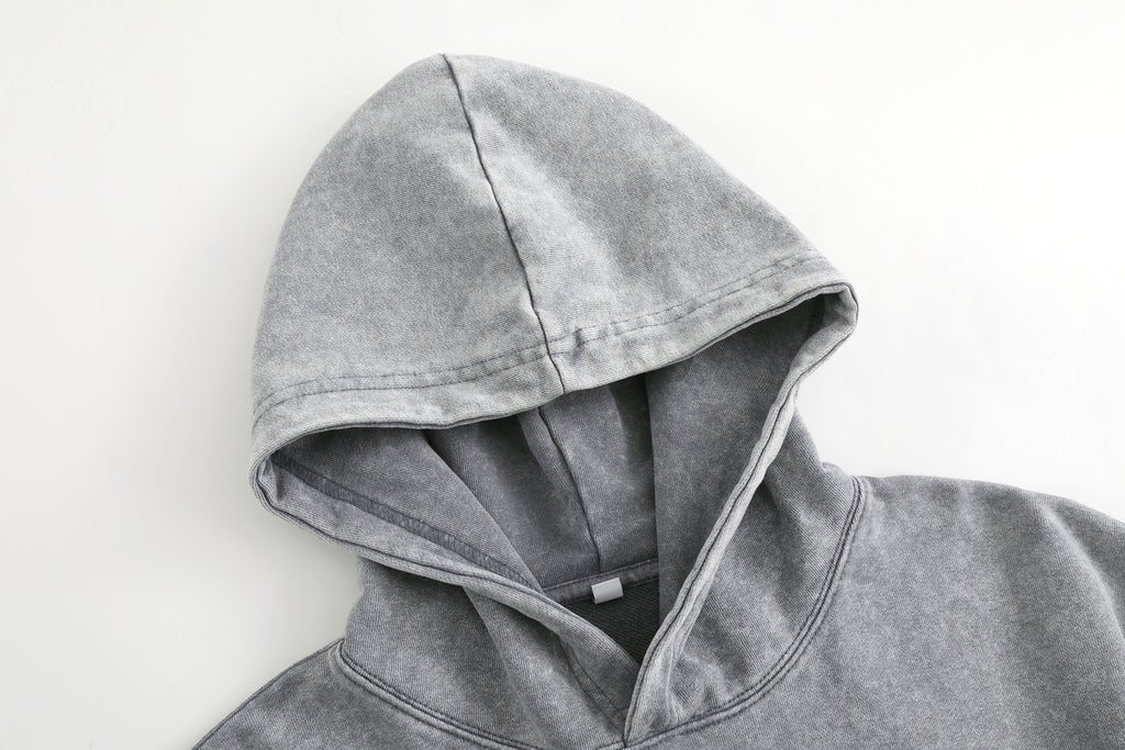 Vintage-wash distressed hooded sweatshirt—a versatile, relaxed-fit casual jacket with a laid-back, dropped-shoulder style.