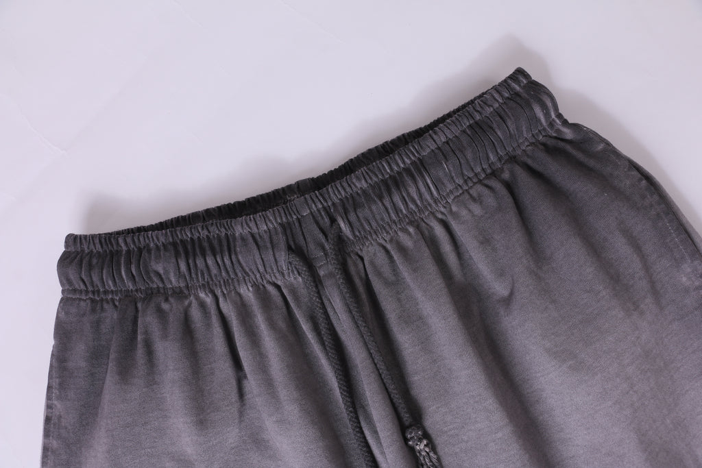 American vintage-style "dirty wash" shorts; distressed, faded, cotton-feel athletic shorts; versatile, casual unisex style.