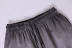 American vintage-style "dirty wash" shorts; distressed, faded, cotton-feel athletic shorts; versatile, casual unisex style.