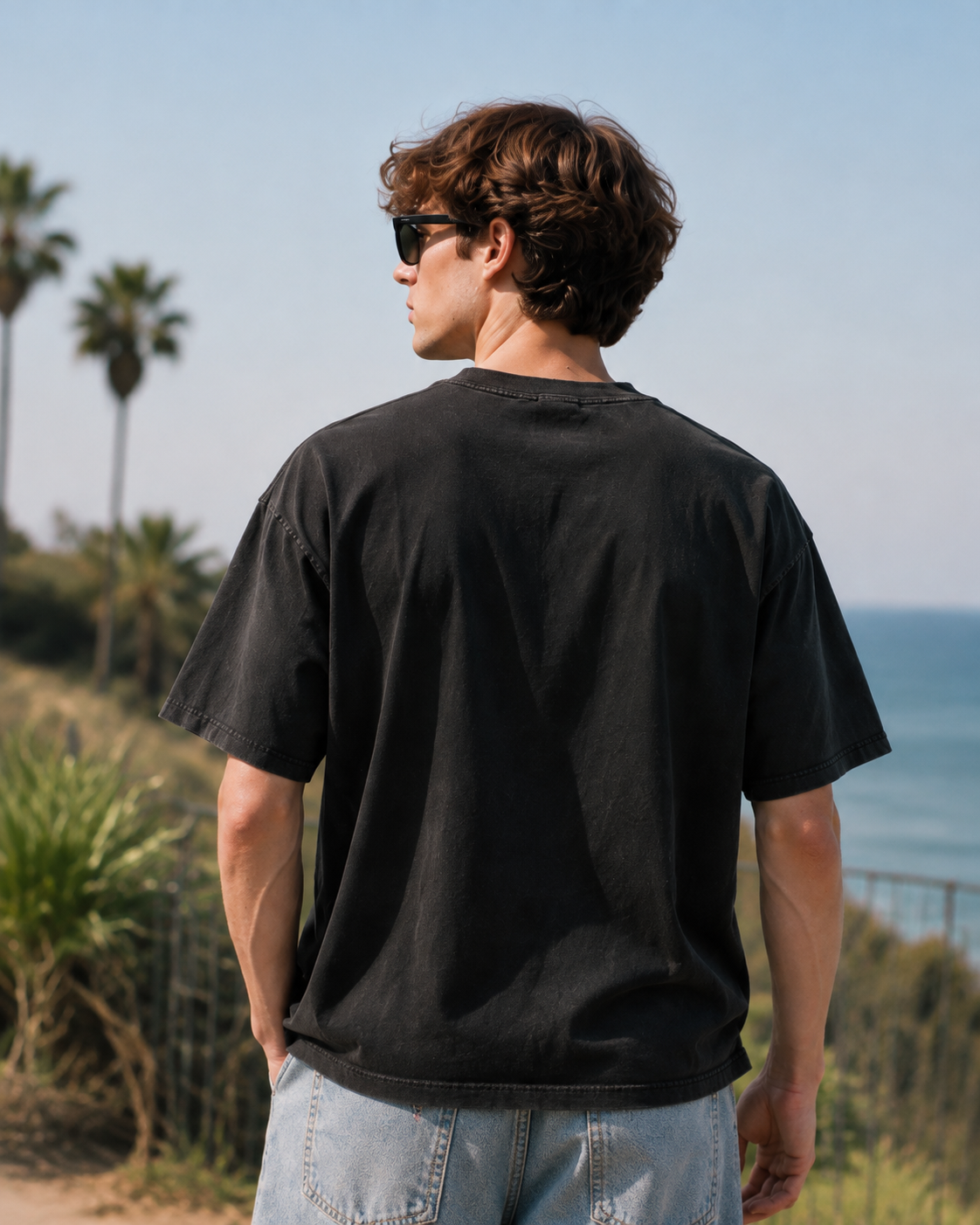 Vintage-style distressed black short-sleeve T-shirt featuring an herbal apothecary graphic; 100% cotton, oversized fit—a unique, retro streetwear piece.